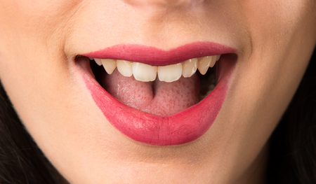 Macro - Close up lips of young woman making surprise gestureの写真素材