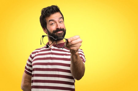 Happy Man with glasses on colorful backgroundの写真素材