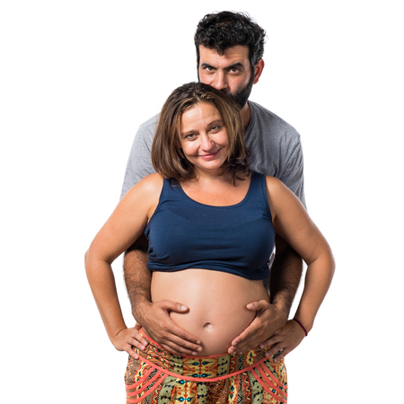 Father and pregnant mother togetherの写真素材