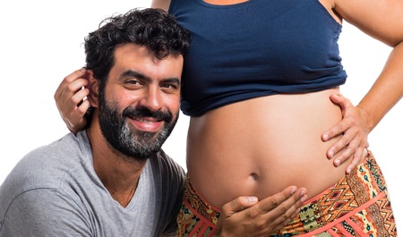 Father and pregnant mother togetherの写真素材