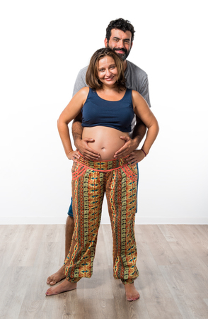 Father and pregnant mother togetherの写真素材