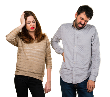 Young couple with back pain and headacheの写真素材