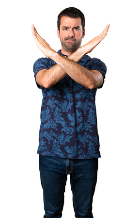 Brunette man making NO gesture on white backgroundの写真素材