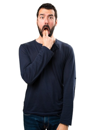 Handsome man with beard making vomiting gestureの写真素材