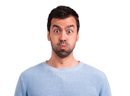 Handsome man makes funny and crazy face emotion