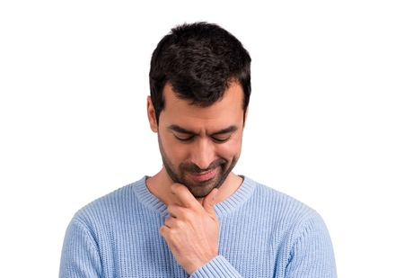 Handsome man standing and looking down