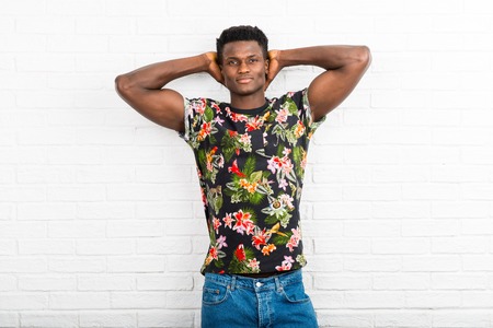 Handsome dark skinned man posing