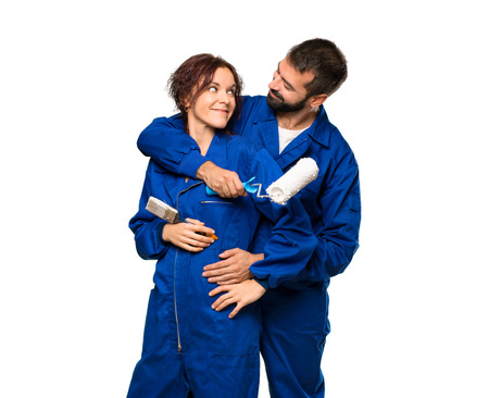 Painters in love hugging on isolated white backgroundの写真素材