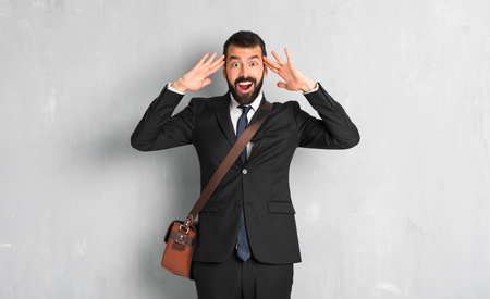 Businessman with beard with surprise and shocked facial expressionの写真素材