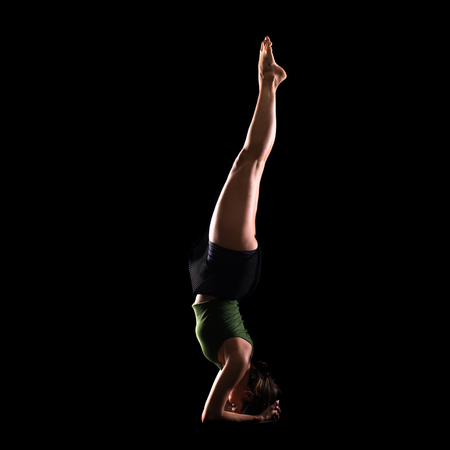 Young girl dancing in studio on isolated background