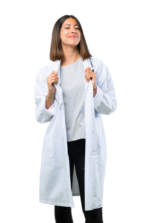 Doctor woman with stethoscope proud and self-satisfied in love yourself concept on isolated white backgroundの写真素材