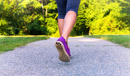 Sport asian woman running outdoors