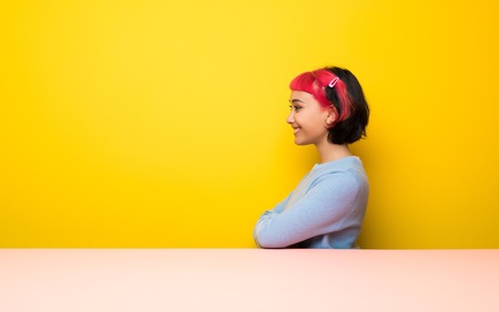 Young woman with pink hair in lateral positionの写真素材