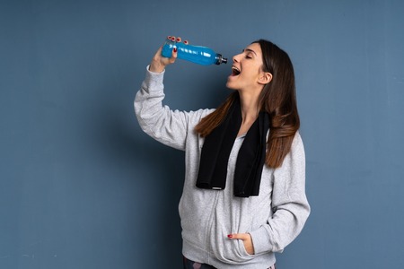 Young sport woman with a bottle of waterの写真素材