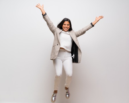 Young Colombian girl jumpingの写真素材