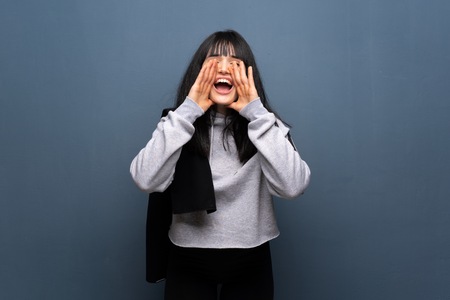 Young sport woman shouting and announcing somethingの写真素材