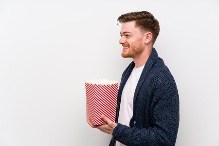 Redhead man with popcornsの写真素材