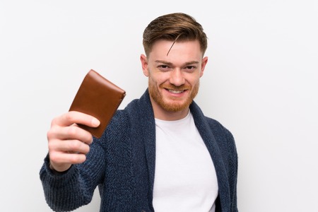 Redhead man holding a walletの写真素材