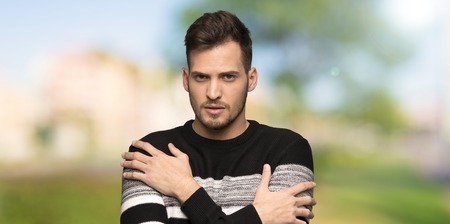 Handsome man freezing at outdoorsの写真素材