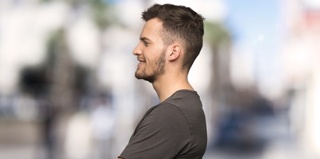 Man with black shirt in lateral position at outdoorsの写真素材