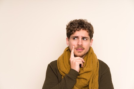 Blonde man with scarf thinking an ideaの写真素材