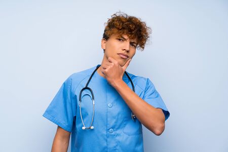 Surgeon doctor african american man laughingの写真素材