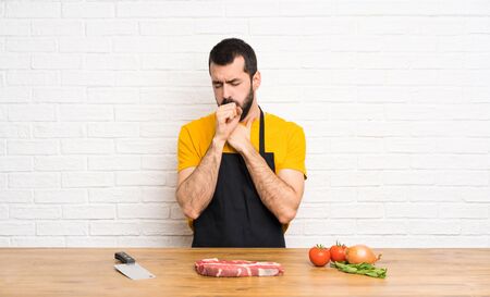 Chef holding in a cuisine is suffering with cough and feeling badの写真素材