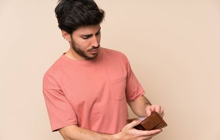 Handsome man holding a wallet