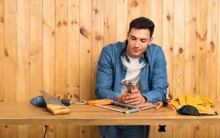 Craftsmen man over wood backgroundの写真素材