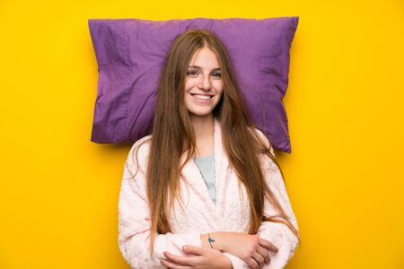 Happy Young woman in dressing gown in a bedの写真素材