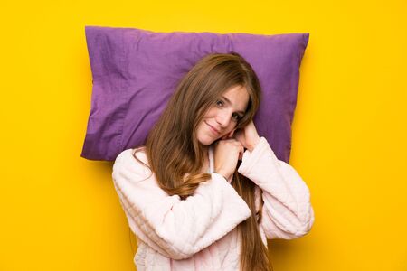 Young woman in dressing gown in a bed sleepingの写真素材