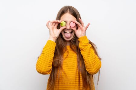 Young woman with long hair with macaroonsの写真素材