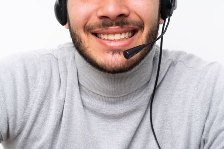 Telemarketer Colombian man working in a officeの写真素材