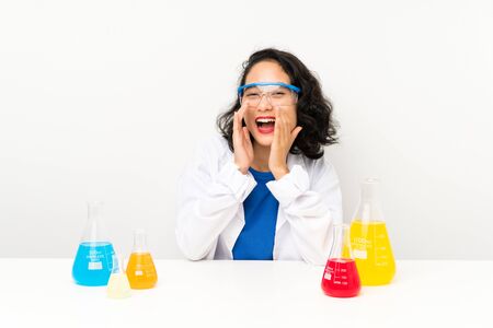 Young scientific asian girl shouting with mouth wide openの写真素材