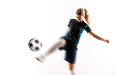 Blonde football player teenager girl over isolated white backgroundの写真素材