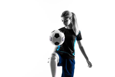 Blonde football player teenager girl over isolated white backgroundの写真素材