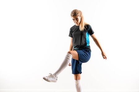 Blonde football player teenager girl over isolated white backgroundの写真素材