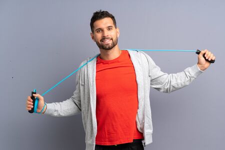 Young sport man with jumping rope