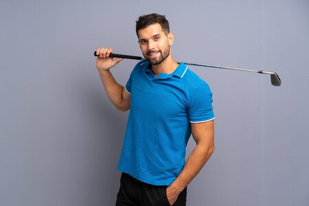 Handsome young man playing golfの写真素材