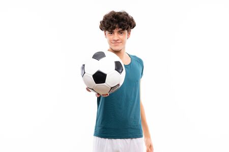 Young football player man over isolated white wallの写真素材