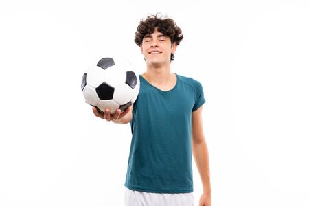 Young football player man over isolated white wallの写真素材