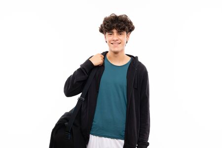 Sport man over isolated white background smiling a lotの写真素材