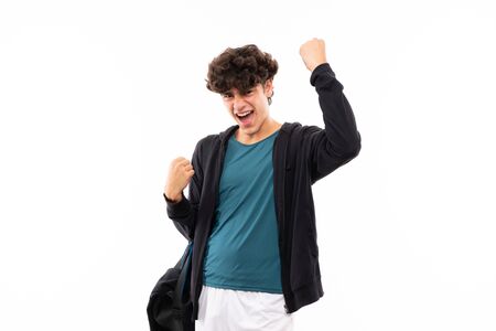 Sport man over isolated white background celebrating a victoryの写真素材