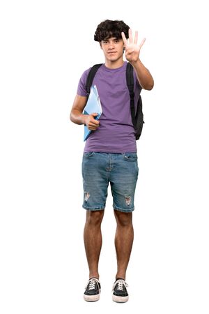 A full-length shot of a Young student man happy and counting four with fingers over isolated white backgroundの写真素材