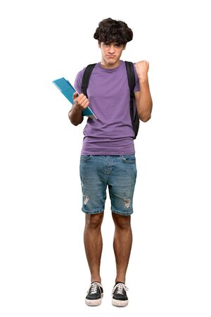 A full-length shot of a Young student man with angry gesture over isolated white backgroundの写真素材