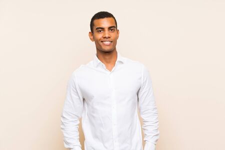 Young handsome brunette man over isolated background laughingの写真素材