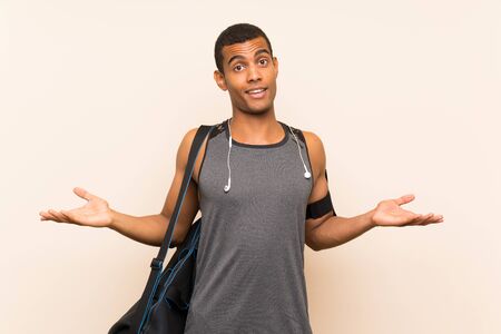 Sport man over isolated background with shocked facial expressionの写真素材
