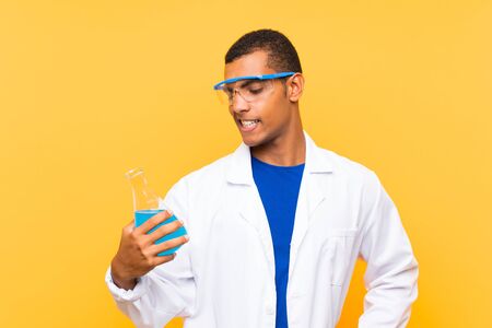 Scientific man holding a laboratory flask over isolated backgroundの写真素材