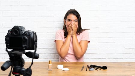 Young girl recording a video tutorial with surprise facial expressionの写真素材