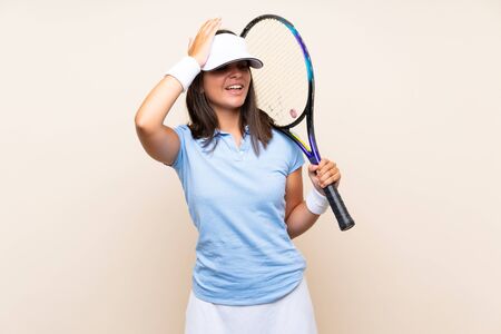 Young woman playing tennis over isolated background has realized something and intending the solutionの写真素材